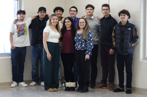 Precollege students standing together and smiling!