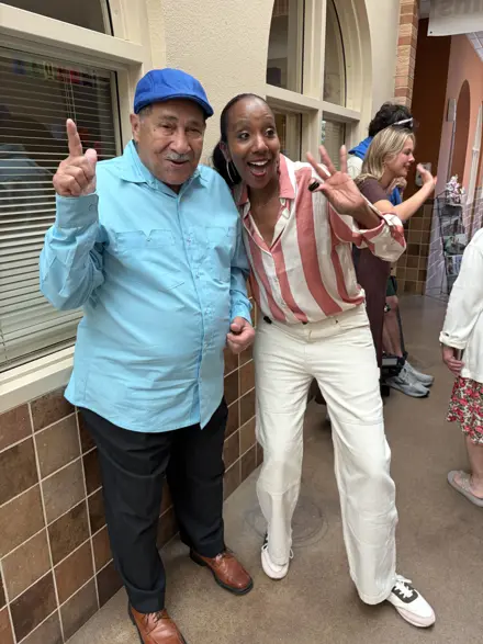 Male senior center client with TV Personality at a Special Event held at the Senior Center