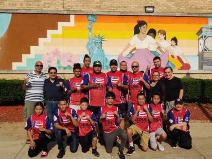 Group of UCC Boxing Students and staff standing outside UCC Building