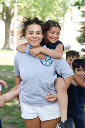 UVC Student smiling with a student in the park