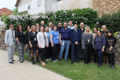 Group Photo of Human Services Employees outside of the Human Services Building