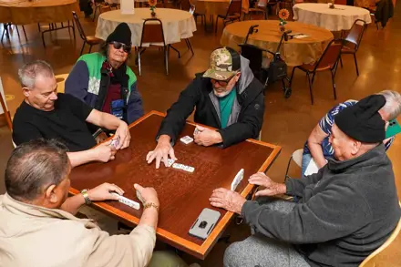 Group of Senior men playing dominoes at the UCC Senior Center